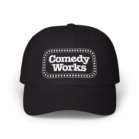 Black cap with 'Comedy Works' printed on a white background